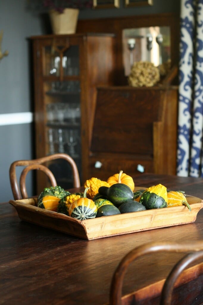 #EclecticallyFall bamboo tray filled with gourds as centerpiece