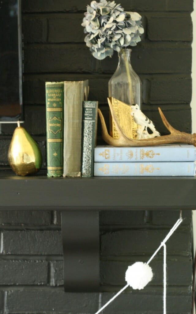 #EclecticallyFall mantle with vintage books, antlers, dried hydrangeas, gold