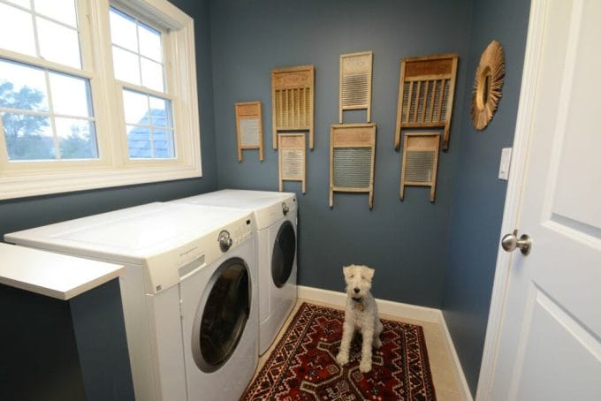 Laundry Room Makeover Reveal- vintage rug, vintage washboards as wall art