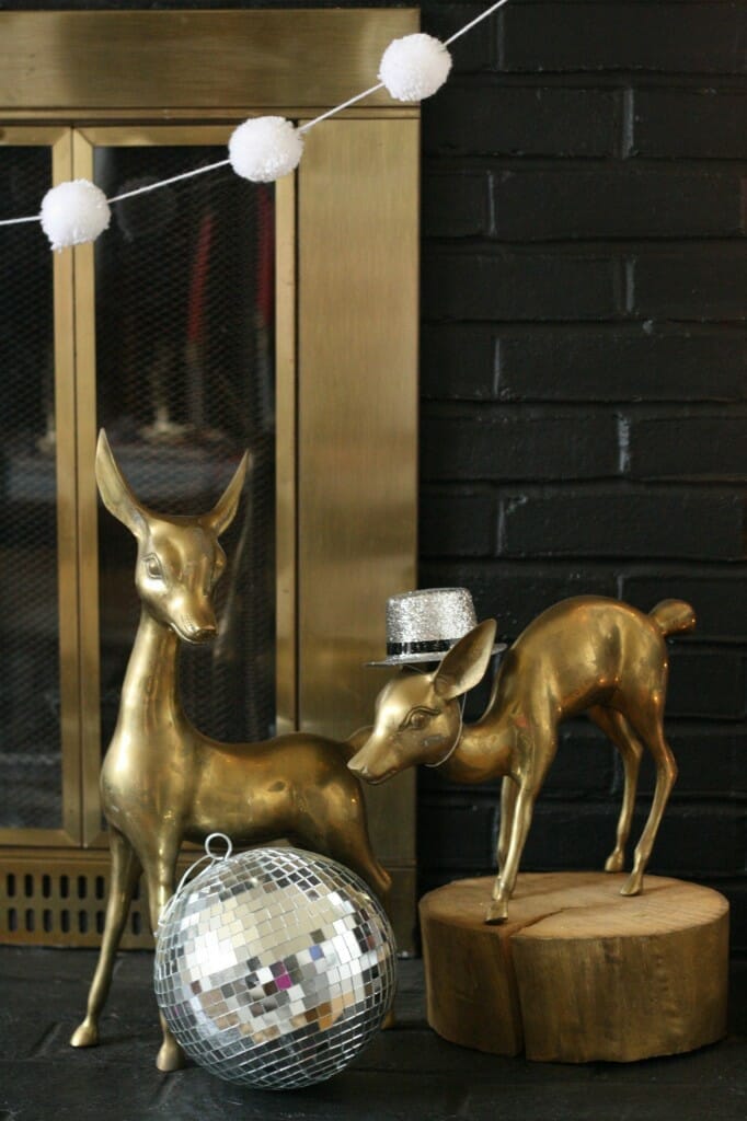mantle brass deer with party hat and disco ball