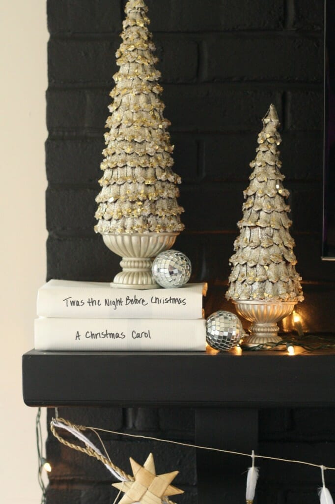 holiday mantle in black and white and sparkle