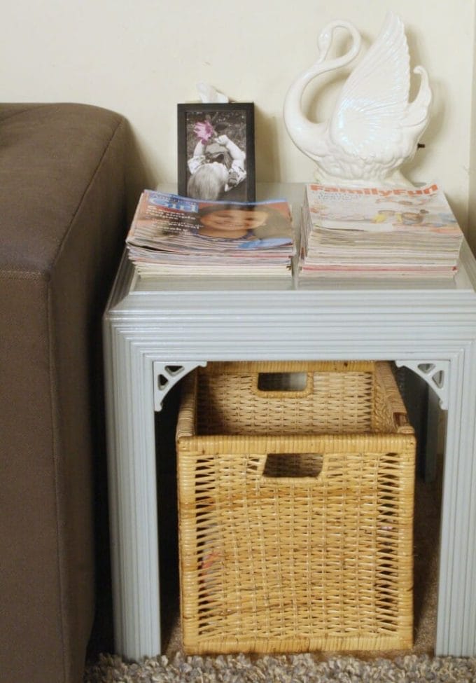 playroom end table with stacked magazines