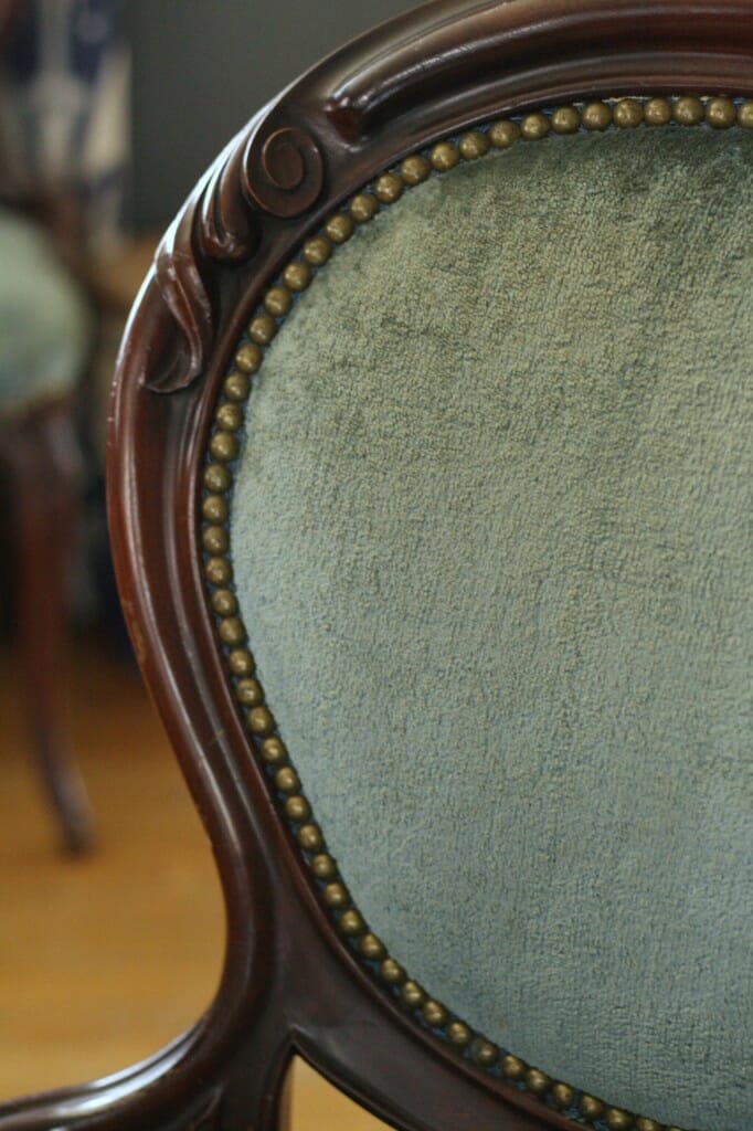 gorgeous nailhead trim and details on dusty blue velvet chairs
