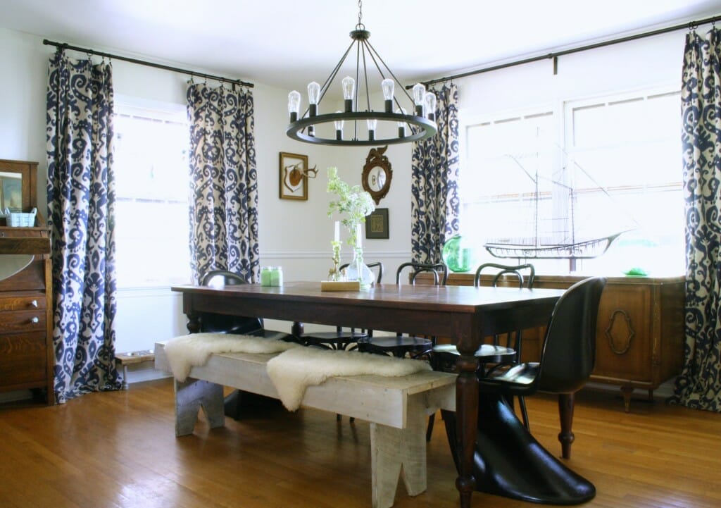 Eclectic Dining room in black, white, wood, navy, with green accents.