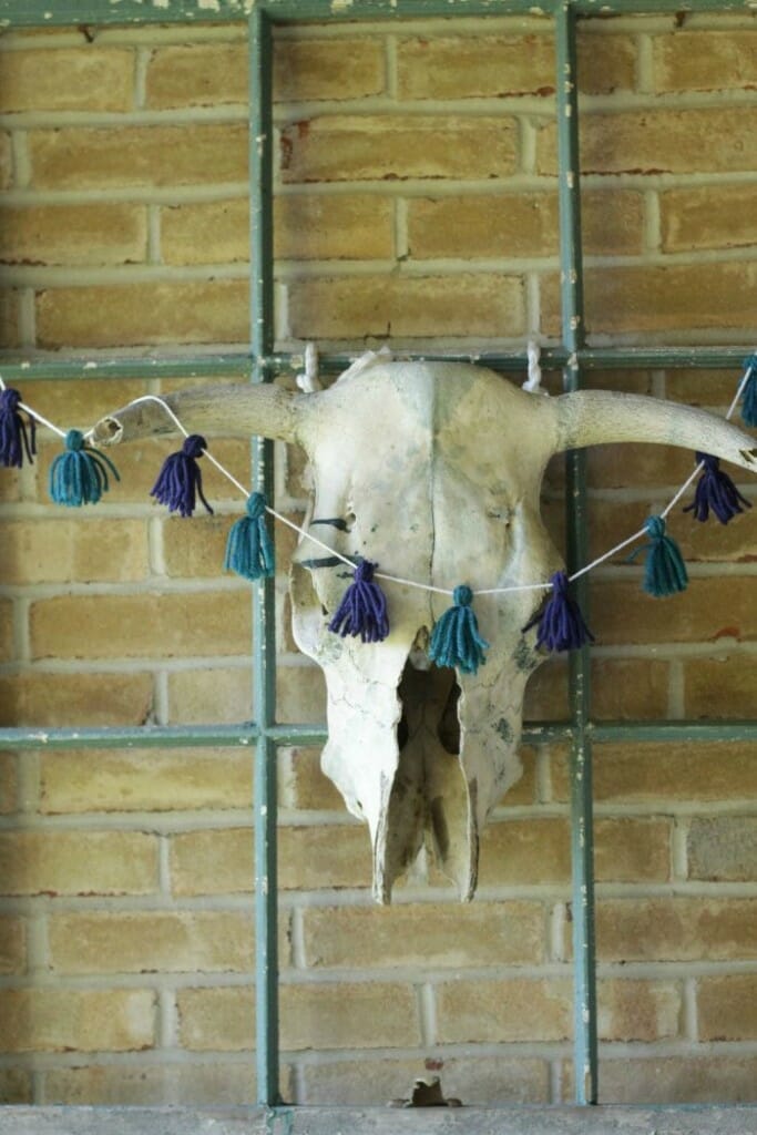 Bull Skull with tassel garland on Fall porch