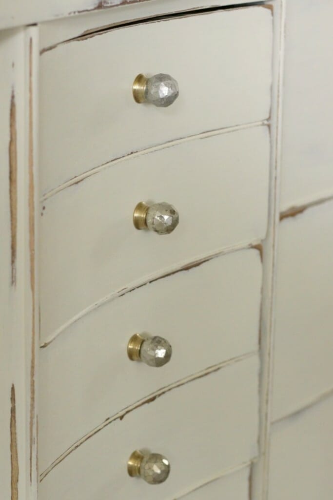 faceted silvered knobs on white distressed dresser