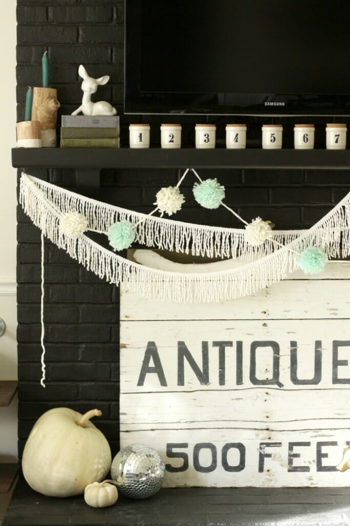 Pom Poms & Tassels with numbered jars on Thanksgiving mantle in black and white