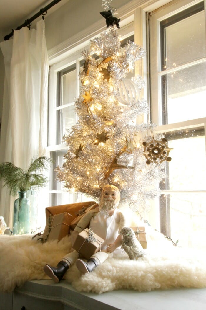 Tinsel tree with vintage Santa in dining room