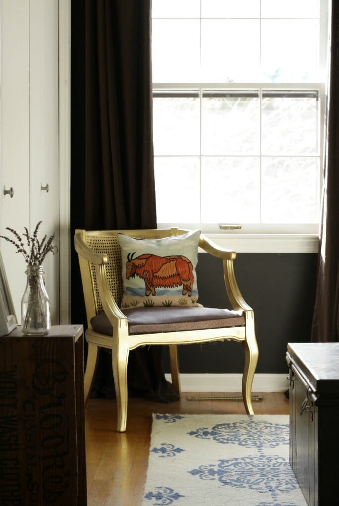 Gold barrel chair with crewel work pillow