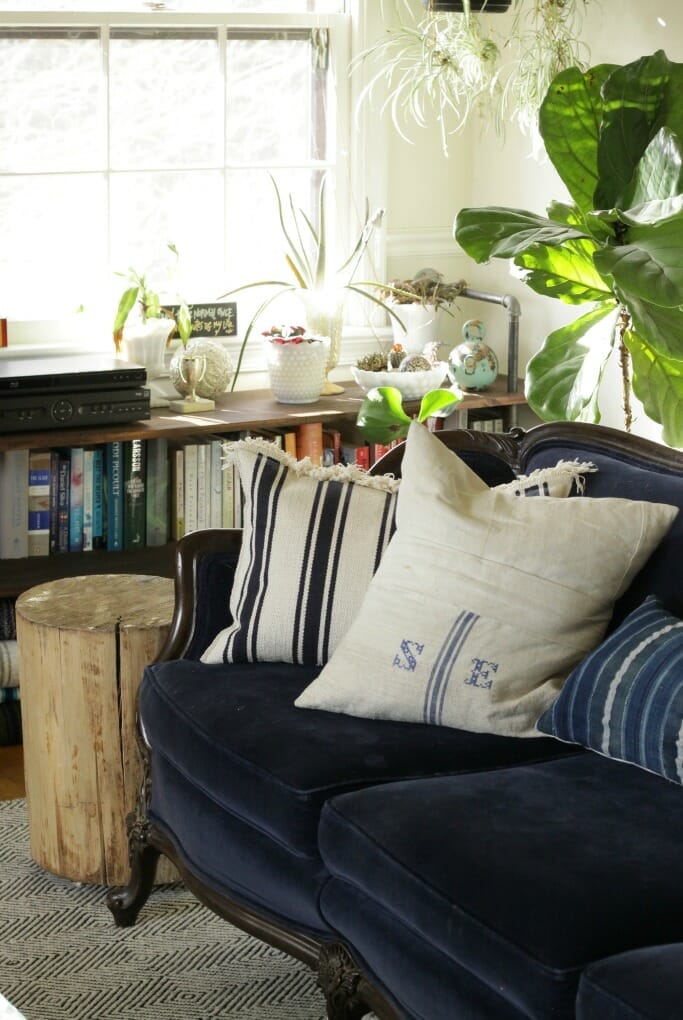 Navy vintage velvet couch with grainsack pillow