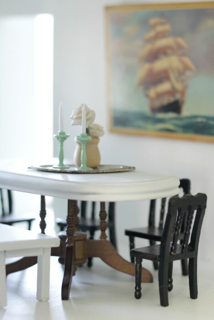 Dollhouse dining area in black, white, wood, nautical art