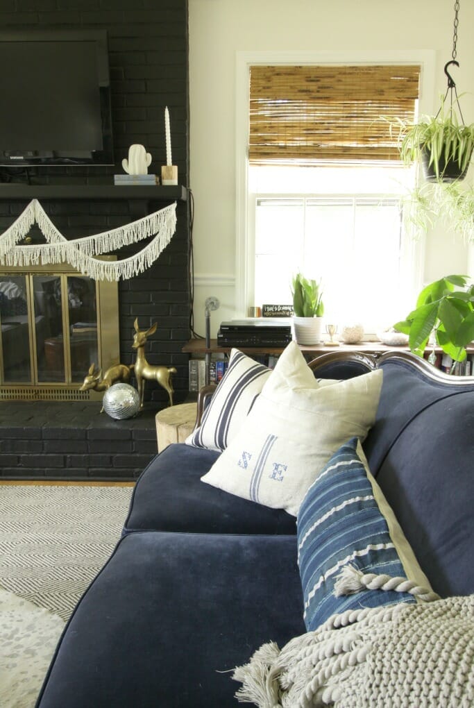 Fabulous Vintage Velvet Sofa and Black Fireplace- modern boho-eclectic