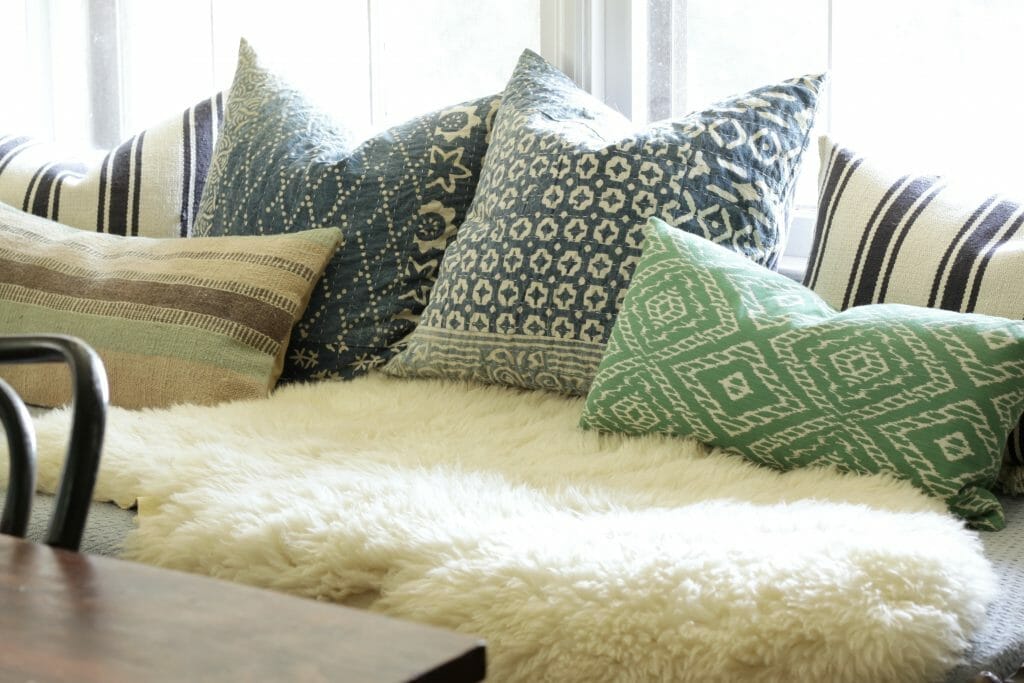 cozy-pillows-and-sheepskin-daybed