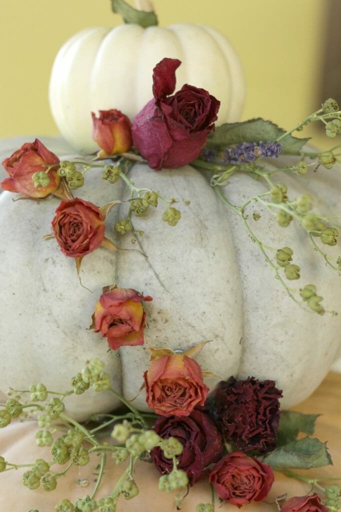 cascading dried flowers on pumpkin display