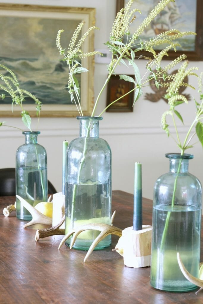 simple-fall-table-centerpiece-antlers-pears-weeds-bottles