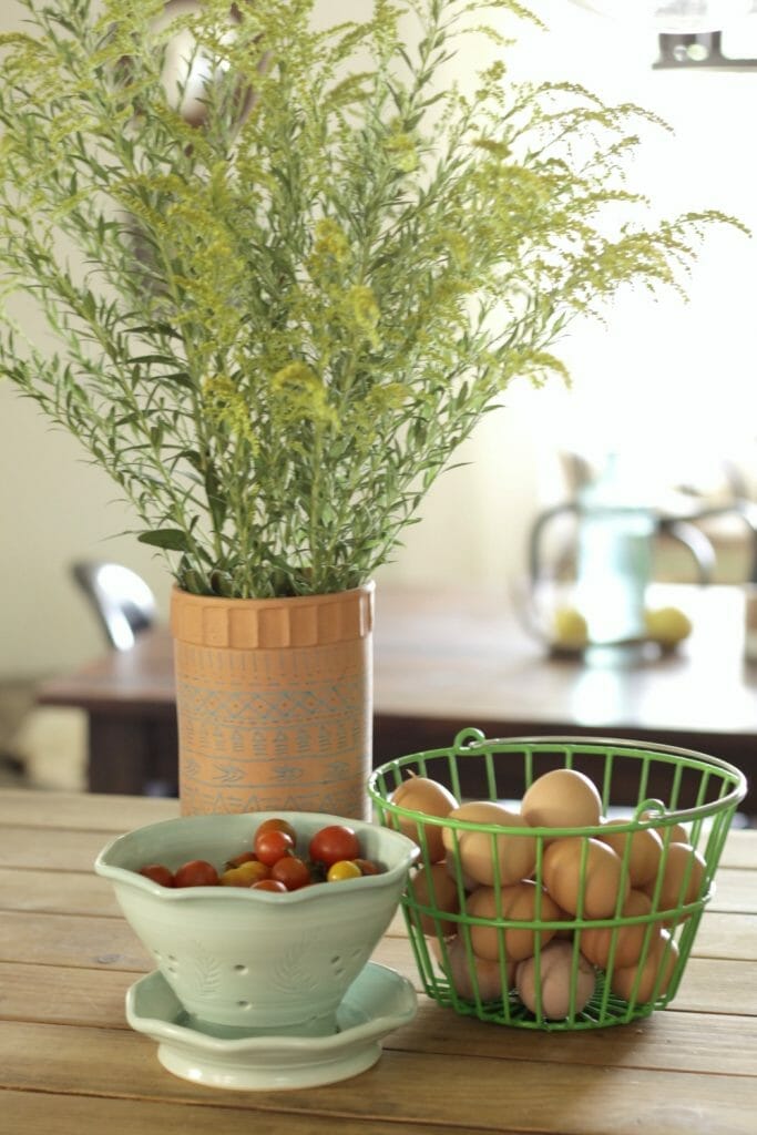 weeds-and-farm-fresh-eggs-tomatoes-as-floral-centerpiece