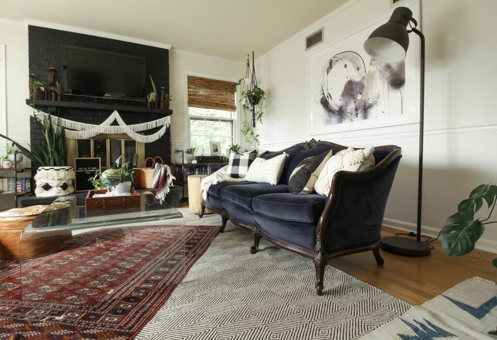Navy Vintage Sofa in fall living room- layered rugs