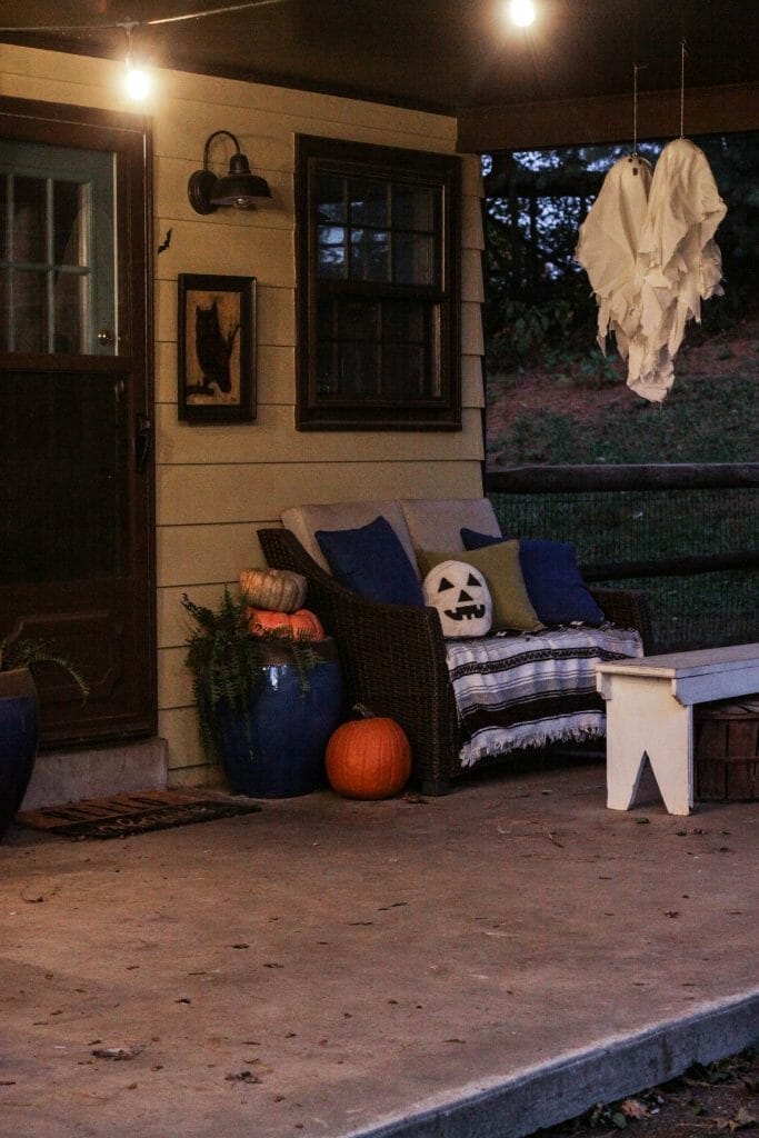 Hanging ghosts as halloween porch decor