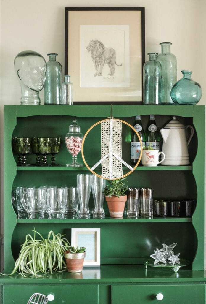 Green hutch shelfie styled with aqua glass