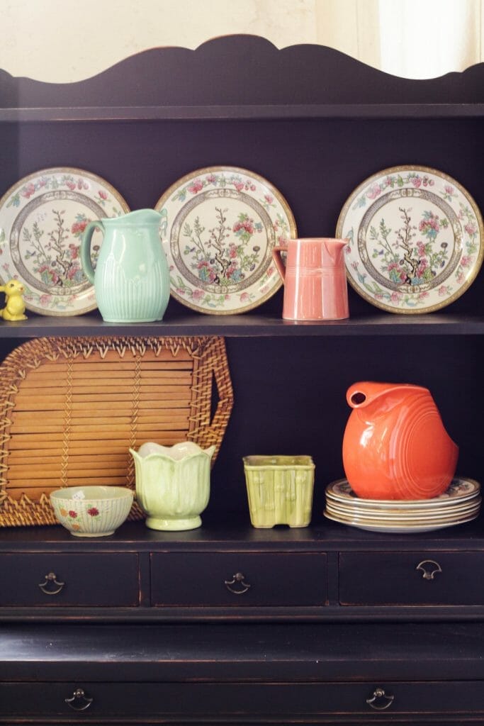 Colorful dishes on black hutch