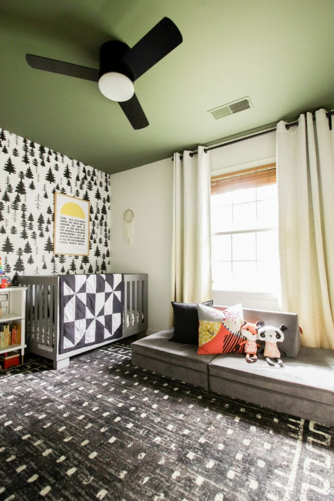 Modern Boho Nursery with Green Ceiling and Tree Wallpaper