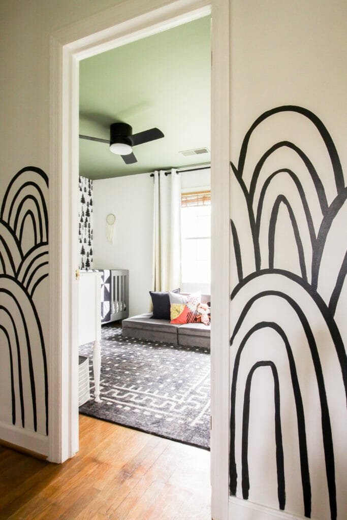 black and white patterned walls with green ceiling