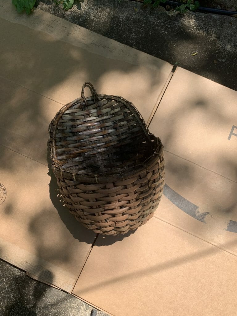 Basket on cardboard to spray paint