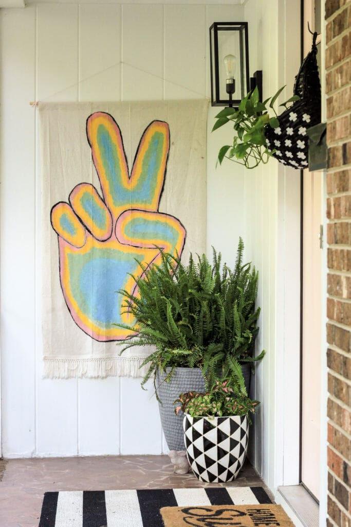 modern boho summer porch with peace sign flag