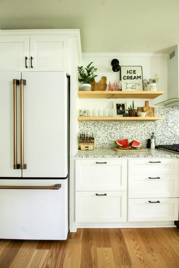 modern white and gold kitchen with watermelon