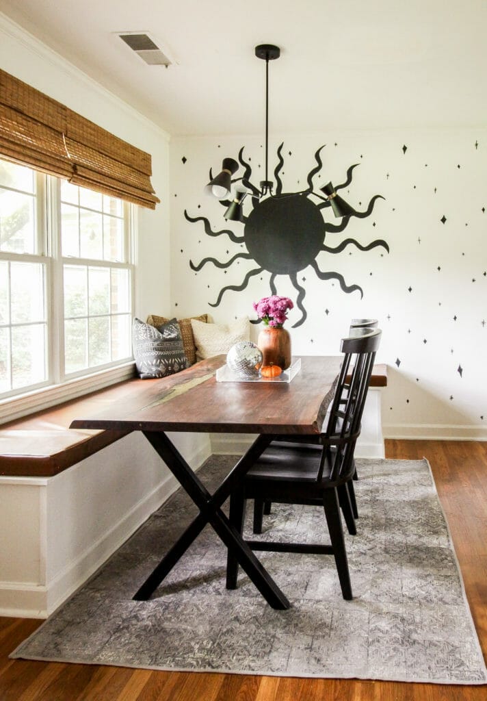 neutral dining room with sun mural