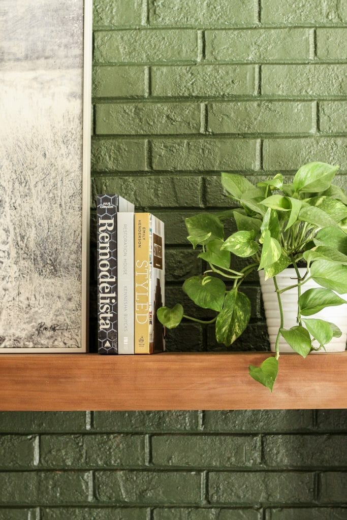 minimal mantel with books and plants