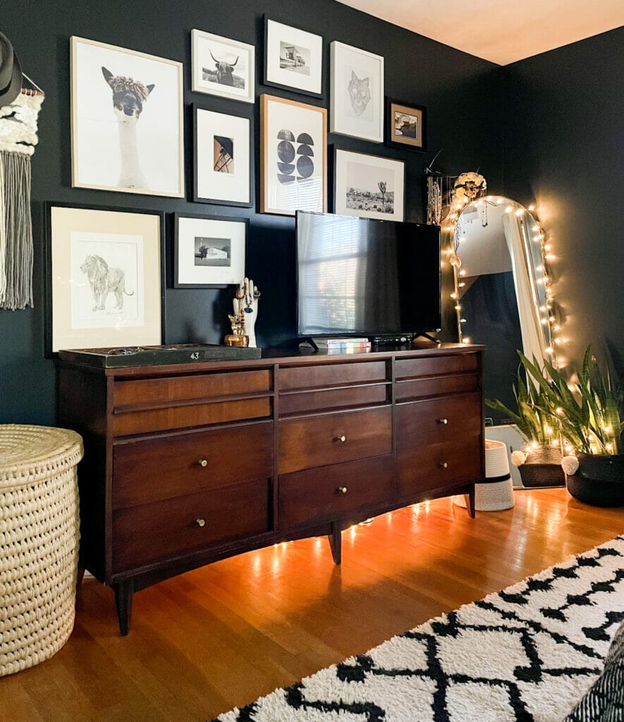 eclectic gallery wall with string lights